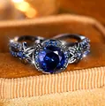 Anillo de oro rosa con piedra azul zafiro y banda negra con diseño floral retro - Talla 5 / Negro Dorado Azul Real Circonita