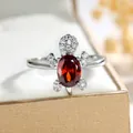 Creative silver sea turtle ring with oval red gemstone and white zircon accents - Size 6 / Red Zirconia