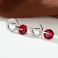 Detailed view of silver hoop earrings with a faceted red zircon drop and micro-pave stones - Platinum Plated Red Zirconia