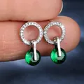 Silver drop earrings featuring round emerald green zircons and pavé-set white crystals - Platinum Plated Green Zirconia