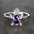 Turtle ring in silver finish featuring an oval purple gemstone and crystal pavé details - Size 6 / Purple Zirconia
