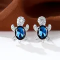 Orecchini a perno a tartaruga in argento con gemma blu e scintillanti zirconi cubici - Placcato Platino Blu Reale