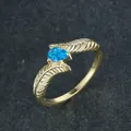 Macro detail of gold feather ring featuring a vibrant pear-cut blue opal gemstone - US 6 / Gold Blue Opal