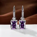 Silver drop earrings featuring large rectangular purple gemstones and sparkling zircon accents - White Gold Plated Purple Zircon