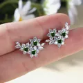 Exquisite silver flower stud earrings with vibrant emerald green and white zircon stones - Emerald Green Zirconia