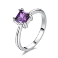 Macro view of princess cut square purple gemstone in a four-prong platinum setting ring - Size 6 / Purple Zirconia