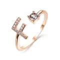 Rose gold open ring featuring letter F with micro-pave crystals and a round solitaire stone - Letter F / Rose Gold