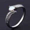 Silver feather ring featuring a teardrop white opal stone in a luxury boho style - US 6 / Platinum White Opal