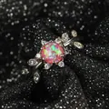 Macro shot of silver ring with pink opal center stone and marquise leaf zircon detail - US 6 / Purple
