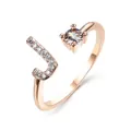 Adjustable rose gold ring featuring a letter J motif with small zircons and a single round diamond - Letter J / Rose Gold