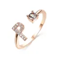 Rose gold adjustable open ring featuring a crystal stone and a pavé letter R design - Letter P / Rose Gold