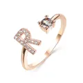 Rose gold adjustable ring featuring a letter R design with micro-pave cubic zirconia - Letter R / Rose Gold