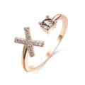 Adjustable rose gold open ring with a round zircon stone and shimmering cross element - Letter X / Rose Gold