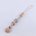 Detail of wooden beech rings and light blue silicone beads on a baby pacifier clip - Grey Blue