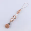 Détail de l'attache-tétine en bois de hêtre avec perles en silicone blanc pour bébé - Blanc