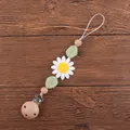 Détail d'une attache-tétine en silicone marguerite avec perles en bois de hêtre naturel - Blanc