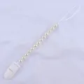 Close-up of baby pacifier clip with cream imitation pearls and durable white plastic buckle - White
