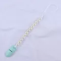Detail of baby pacifier clip with cream faux pearls and mint green plastic fastener - Mint Green