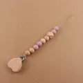 Detail of wooden heart clip and silicone beads for baby pacifier chain accessory - Dusty Rose
