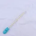 Detail of sky blue plastic clip and white pearl beads on baby pacifier leash - Lake Blue