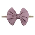 Détail d'un bandeau pour bébé en tissu côtelé avec grand nœud violet et nylon élastique - Violet Taro