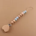 Detail of wooden heart clip and light blue silicone beads on a baby pacifier chain - Grey Blue