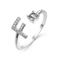 Adjustable silver letter E ring featuring sparkling cubic zirconia and a round solitaire stone - Letter F / Platinum