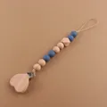 Detail of wooden heart clip with silicone and beechwood beads for pacifier chain - Ink Blue