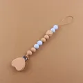 Detail of baby pacifier clip with beech wood heart and light blue silicone beads - Light Blue