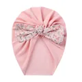 Detailed view of pink baby turban hat featuring a soft floral pattern bow decoration - Light Pink Floral