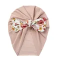 Detail view of pink baby turban hat featuring a large floral bow and soft knit fabric - Khaki Flowers