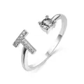 Adjustable silver letter T ring featuring a round solitaire stone and pavé setting - Letter T / Platinum