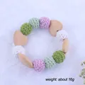 Close-up of baby teether ring with macaron crochet beads and wooden heart toy - Woven Bead Bracelet (7#)