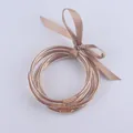 Set di braccialetti in silicone glitter oro con fiocco in nastro di raso - Cachi