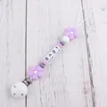 Detailed view of handmade silicone pacifier clip with flower beads and baby letter cubes - Light Purple