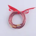 Set di bracciali in silicone glitter rosso con dettagli dorati e fiocco decorativo - Rosso