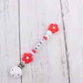 Detail of red flower silicone pacifier clip with BABY letter beads and white plastic clip - Red