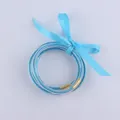 Set di bracciali in silicone blu glitterato con chiusure dorate e nastro di seta - Azzurro