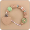 Green silicone daisy and beech wood baby pacifier clip with BABY letter beads - Bean Green