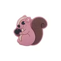 Pink cartoon squirrel silicone shoe charm with dark brown tail holding a black acorn - Dusty Pink