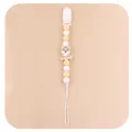 Close-up of baby pacifier clip with silicone beads and a cute cartoon animal charm - Beige