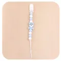 Detail of light blue baby pacifier clip with silicone beads and cartoon tiger charm - Blue