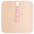 Close-up of pink tiger silicone beads and plastic clip on this baby pacifier chain - Purple