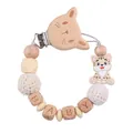 Close-up of beech wood cat clip and silicone beads on the baby pacifier chain - Beige