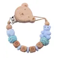 Detail of wooden bear pacifier clip with blue silicone beads and BABY letter beads - Light Blue
