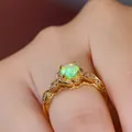 Macro detail of vintage gold flower ring featuring green opal stone and lace hollow band - US 5 / Gold Green