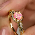 Macro shot of pink opal ring with vintage lace flower pattern and gold plating details - US 5 / Gold Pink