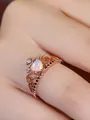 Close-up of rose gold crown ring with heart-shaped opal and delicate hollow detailing - US 6 / Rose Gold White Opal