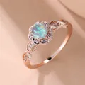 Bague fleur en or rose élégante avec opale ronde centrale et accents de diamants halo - Or rose Blanc