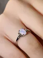 Detailed close-up of opal ring featuring flower design band and colorful gemstone - Size 6 / Platinum White Opal